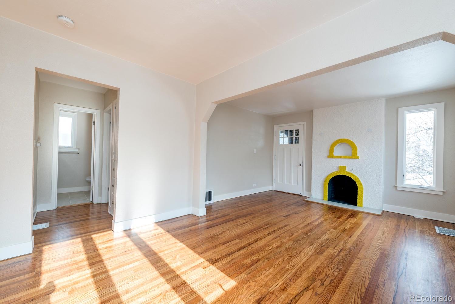 3527 Monroe Street Denver, CO 80205 - Photo 6 of 29 a bedroom with a bed and a window