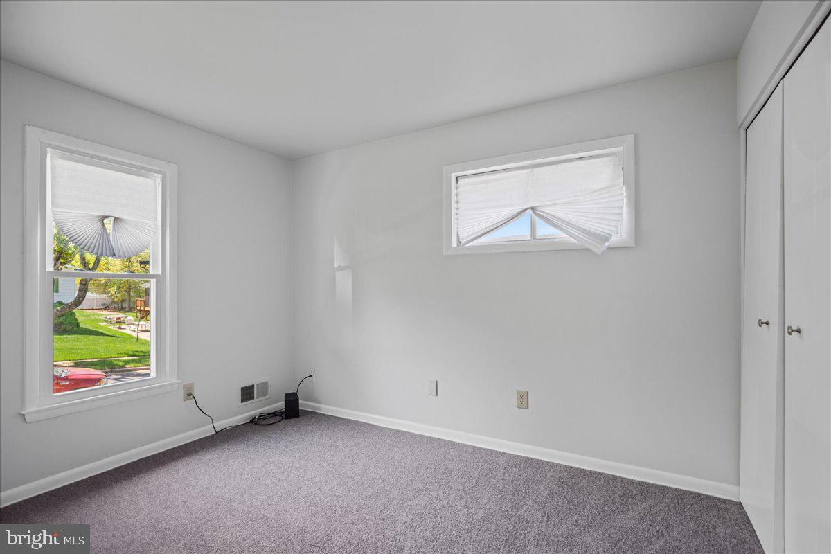 4227 Kinmount Road Lanham, MD 20706 - Photo 16 of 27 a view of an empty room with a window
