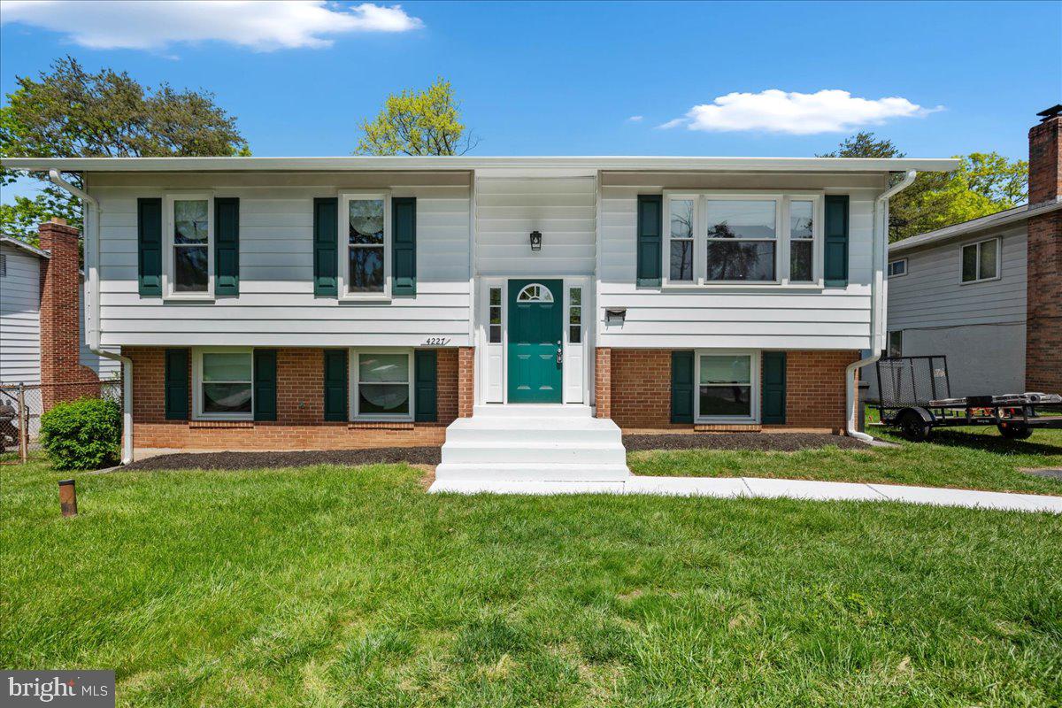 4227 Kinmount Road Lanham, MD 20706 - Photo 4 of 27 a front view of a house with a yard