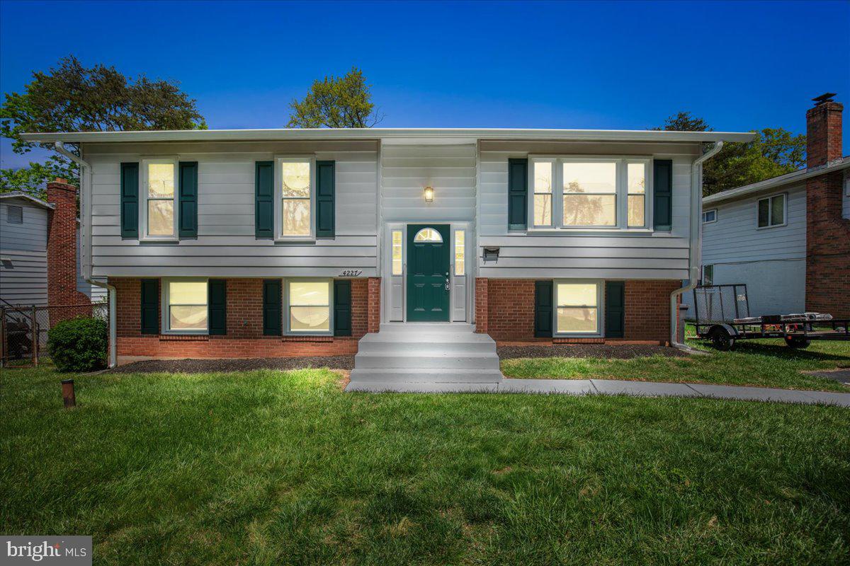 4227 Kinmount Road Lanham, MD 20706 - Photo 5 of 27 a front view of a house with a yard