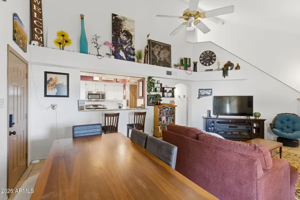 a kitchen with refrigerator and natural light