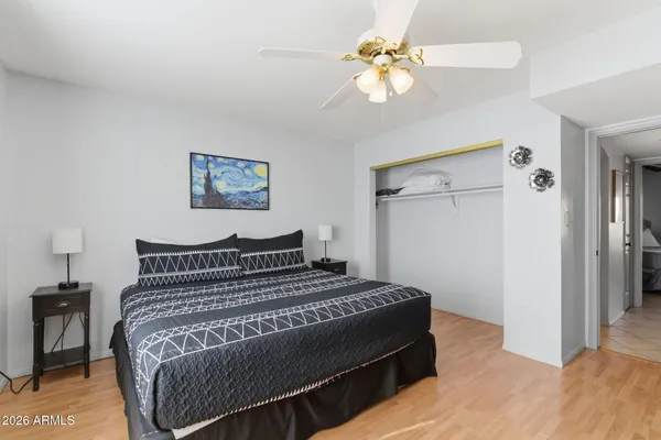 a bedroom with a bed and a chandelier