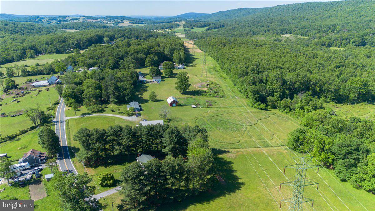 13806 Wolfsville Road Smithsburg, MD 21783 - Photo 31 of 35 an aerial view of residential houses with outdoor space and trees