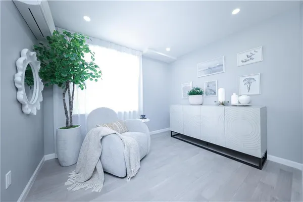 a bedroom with a bed and a plant