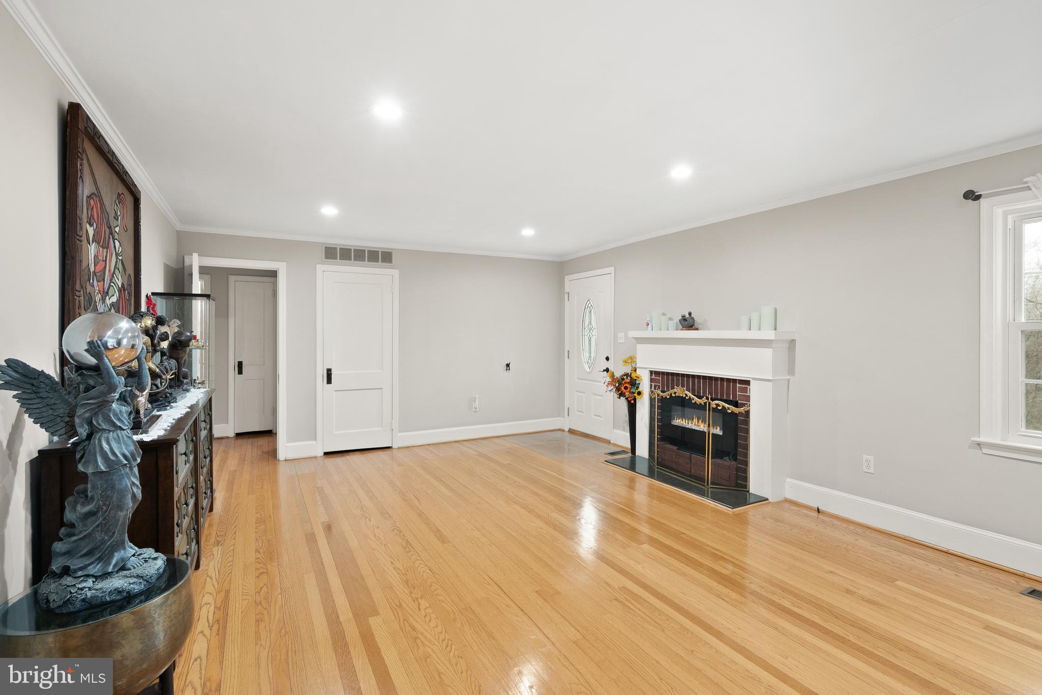 2928 Hunter Road Fairfax, VA 22031 - Photo 11 of 73 a view of empty room with wooden floor and fireplace