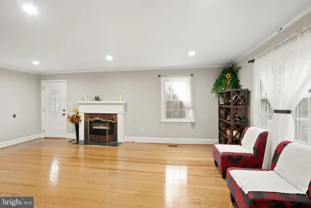 a large kitchen with stainless steel appliances granite countertop a refrigerator and a sink