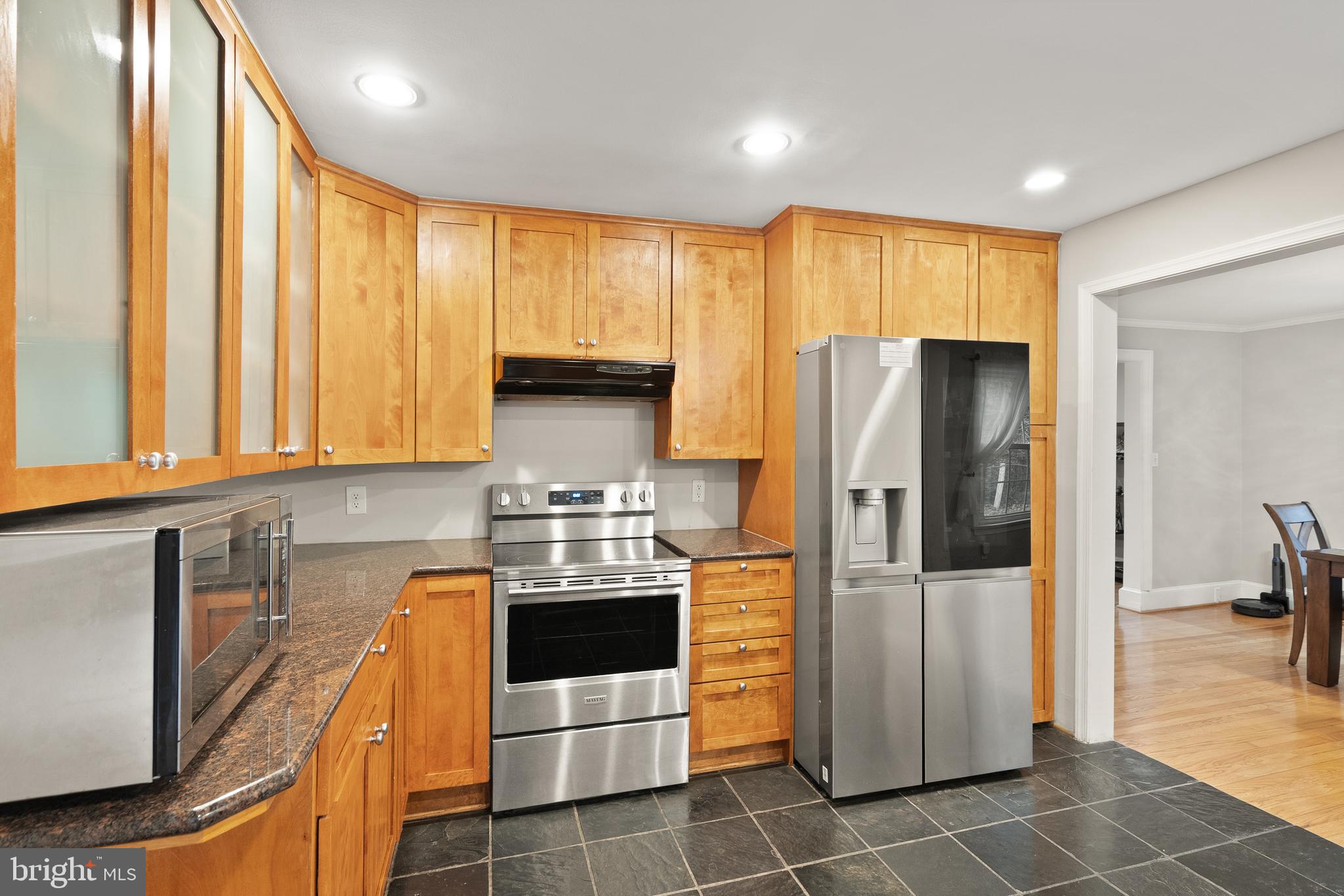 2928 Hunter Road Fairfax, VA 22031 - Photo 21 of 73 a kitchen with stainless steel appliances granite countertop a refrigerator a stove and a sink