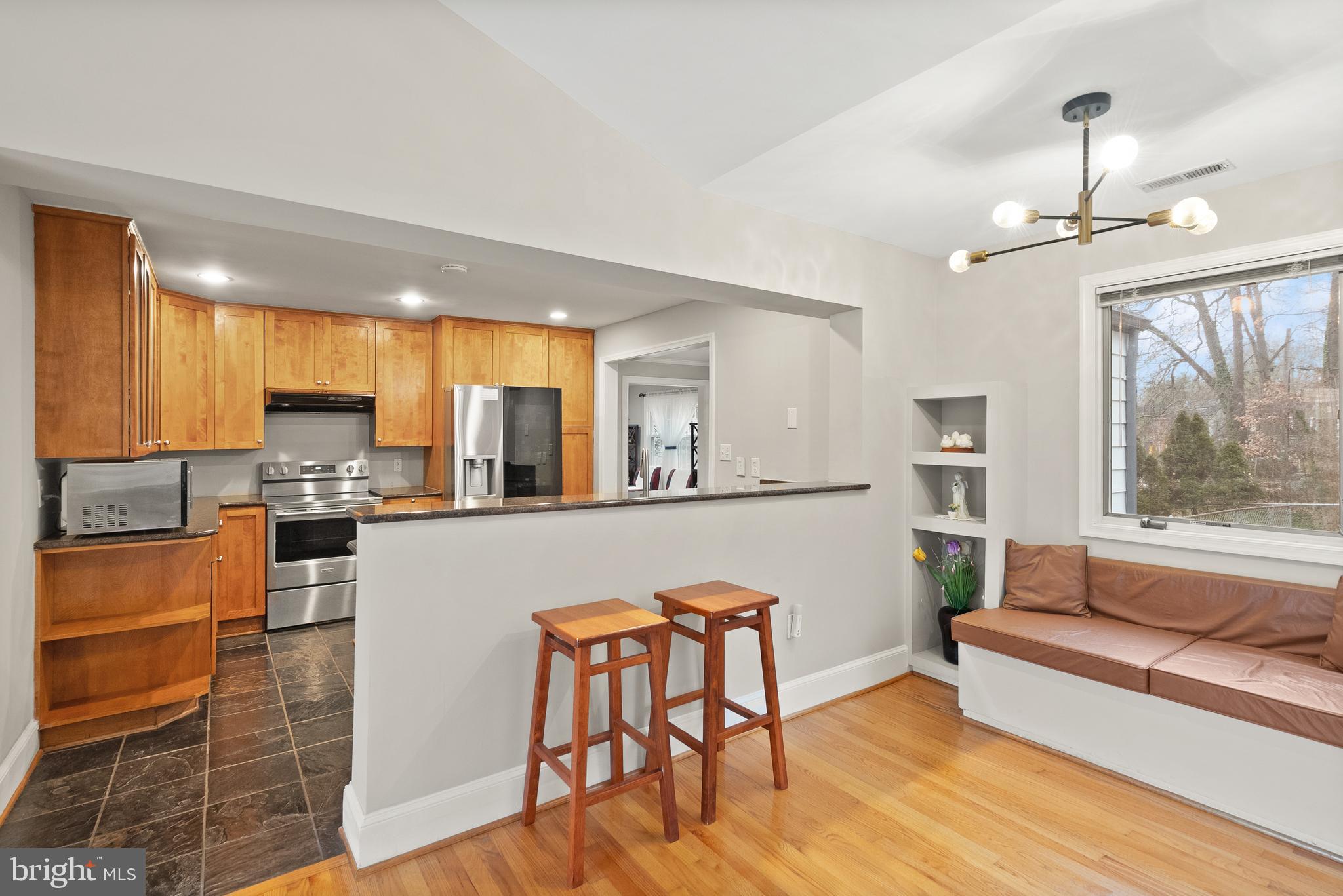 2928 Hunter Road Fairfax, VA 22031 - Photo 22 of 73 a living room with stainless steel appliances granite countertop furniture wooden floor and a kitchen view