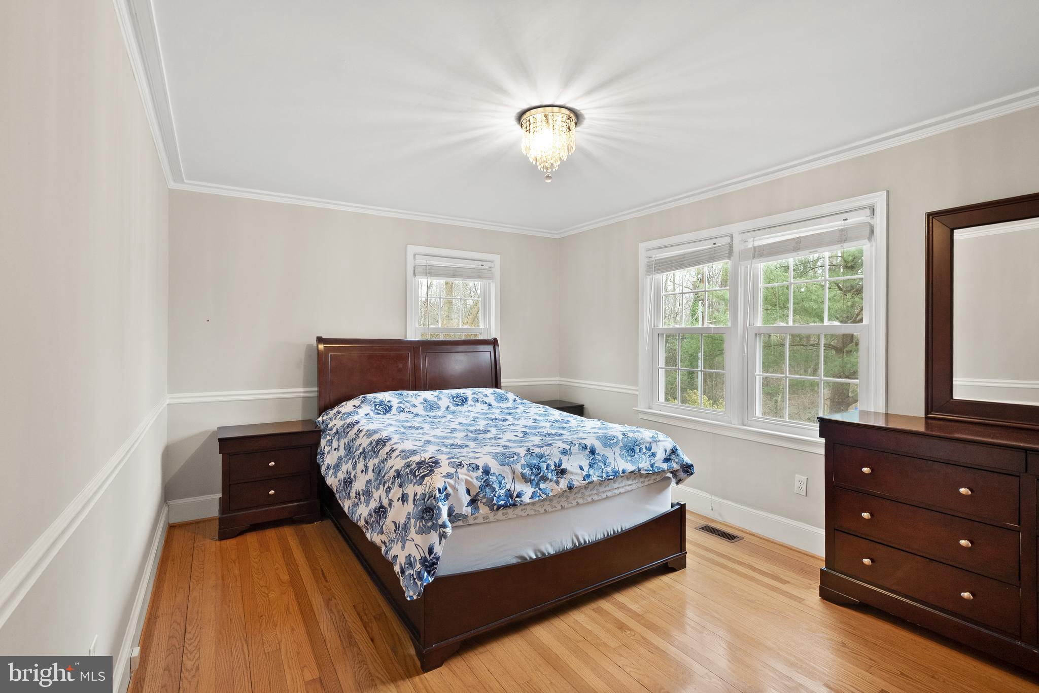 2928 Hunter Road Fairfax, VA 22031 - Photo 30 of 73 a bedroom with a bed and a dresser
