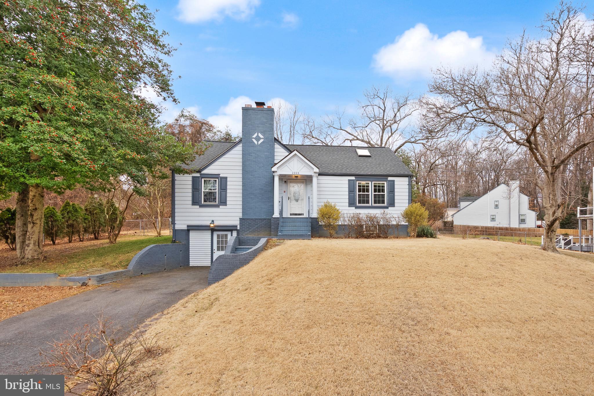 2928 Hunter Road Fairfax, VA 22031 - Photo 3 of 73 a front view of a house with a yard covered in snow