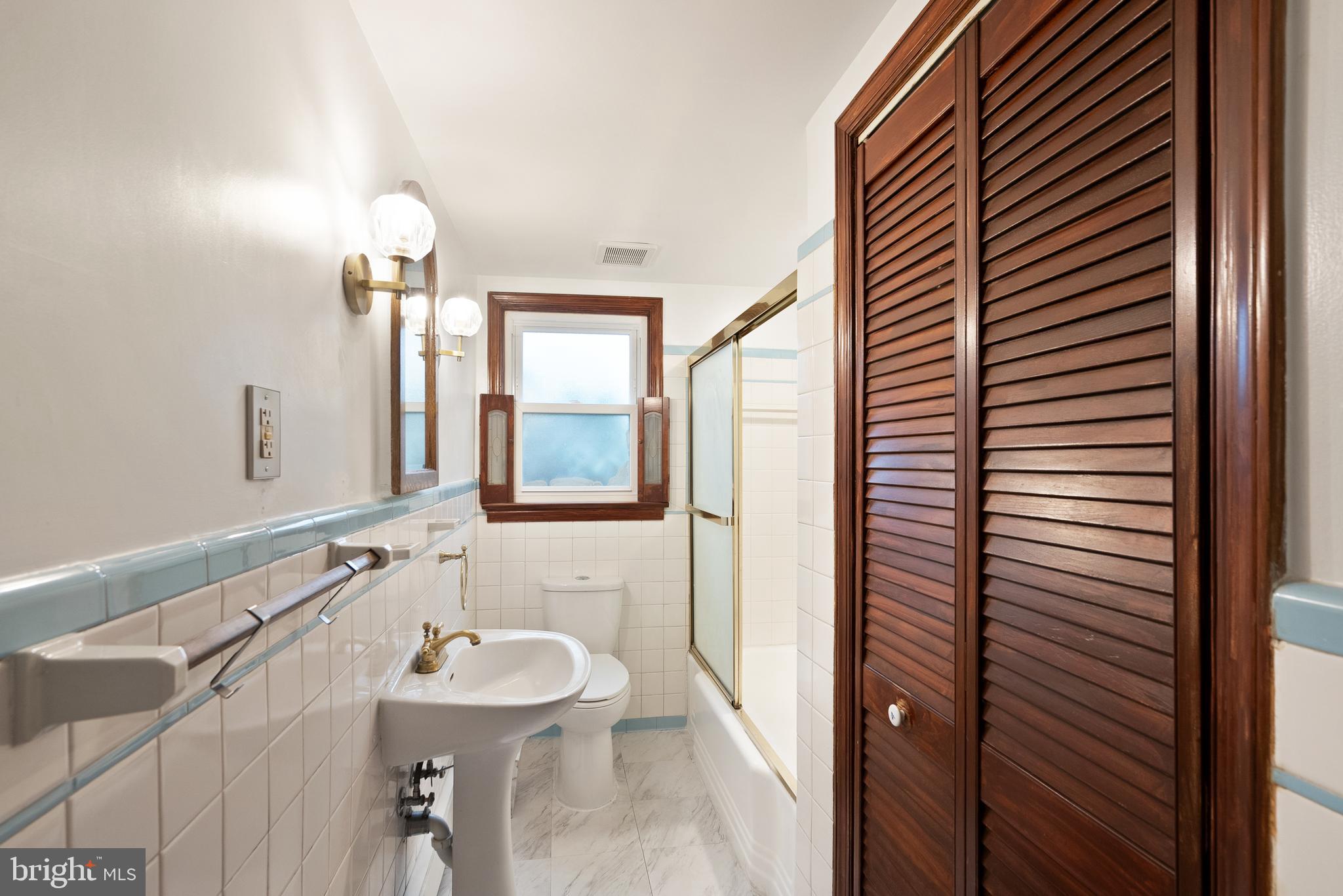 2928 Hunter Road Fairfax, VA 22031 - Photo 36 of 73 a bathroom with a sink and a mirror