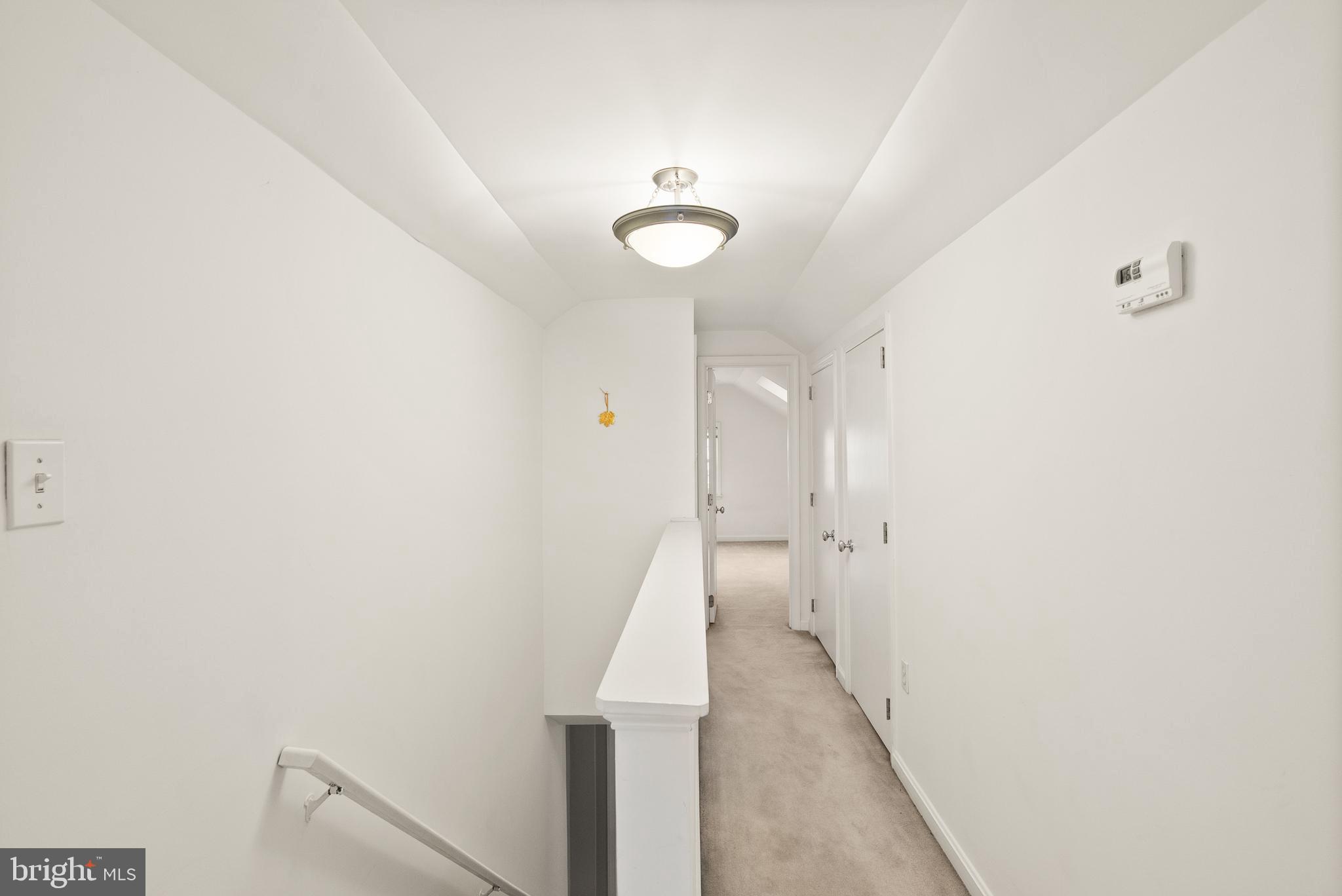 2928 Hunter Road Fairfax, VA 22031 - Photo 38 of 73 a view of a hallway with wooden floor