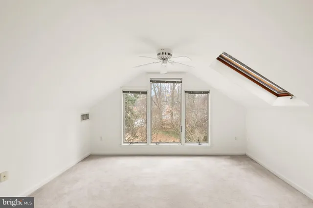 a kitchen with a refrigerator and a stove