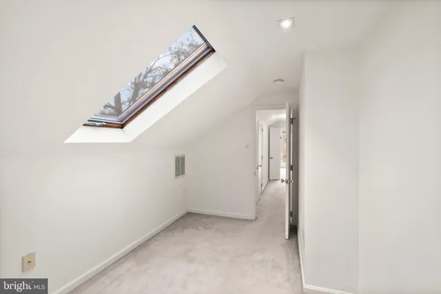 a view of a house with a wooden deck