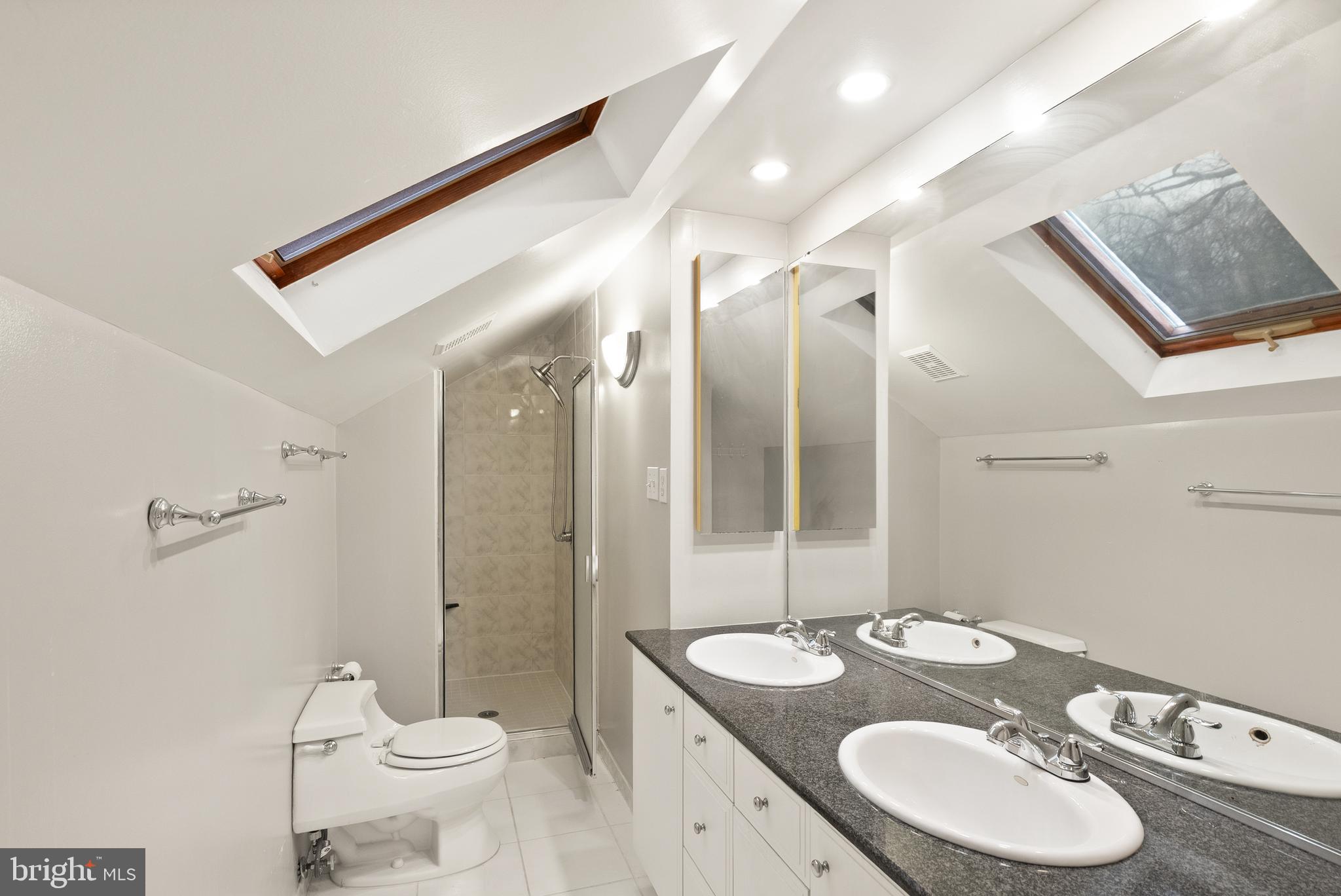 2928 Hunter Road Fairfax, VA 22031 - Photo 47 of 73 a bathroom with a granite countertop sink and a mirror