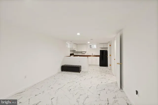 a yellow house with trees in front of it