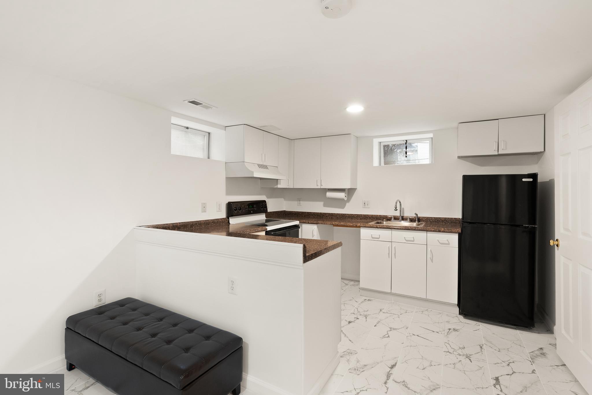 2928 Hunter Road Fairfax, VA 22031 - Photo 52 of 73 a kitchen with a refrigerator and a stove