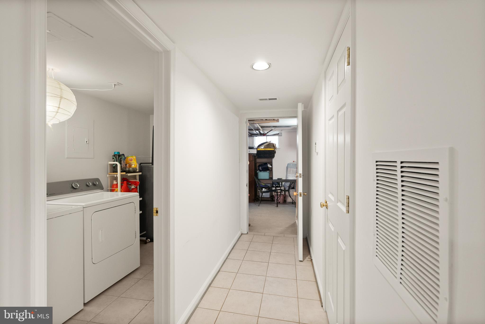 2928 Hunter Road Fairfax, VA 22031 - Photo 61 of 73 a view of a hallway and a livingroom with furniture