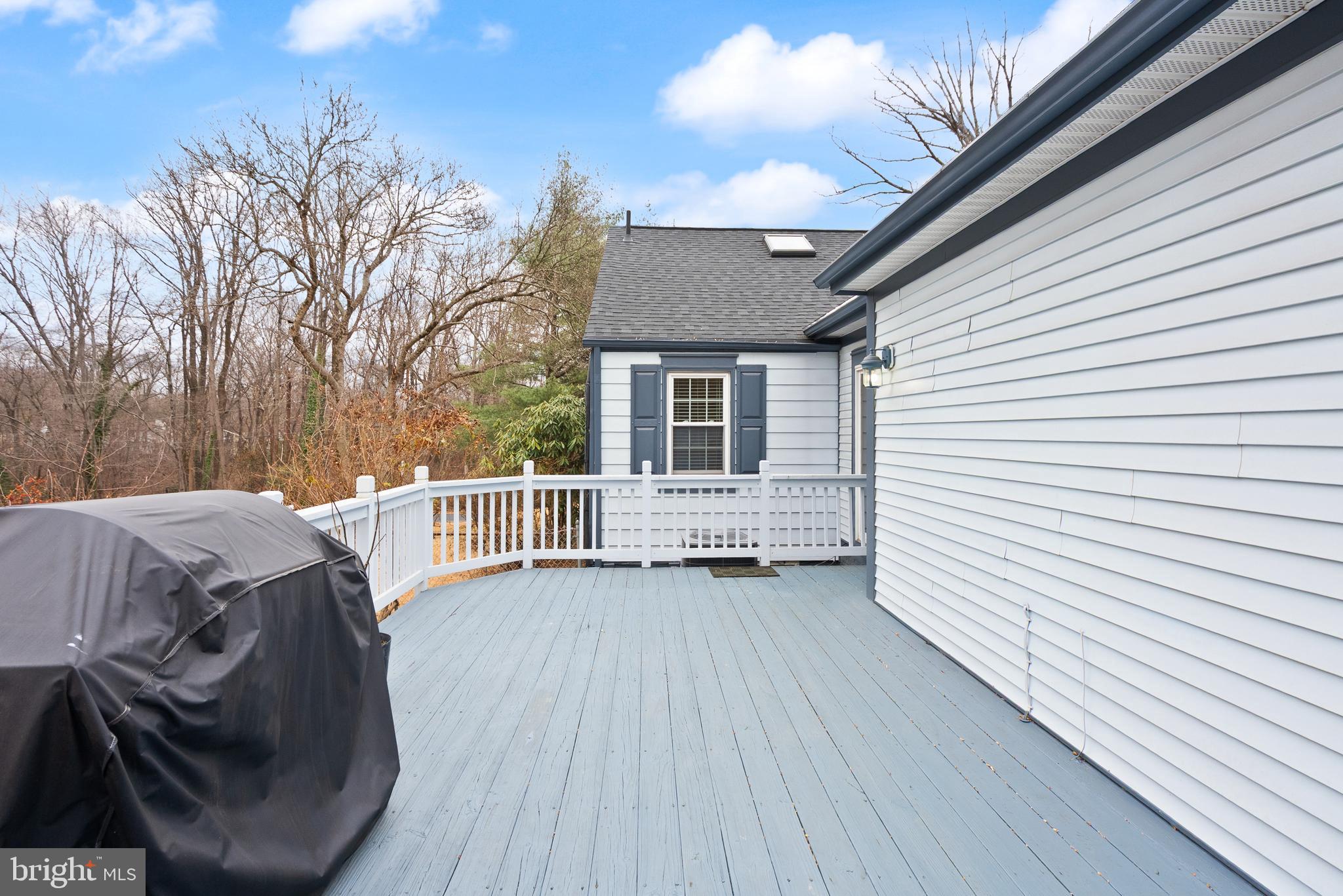 2928 Hunter Road Fairfax, VA 22031 - Photo 67 of 73 a view of a house with a wooden deck