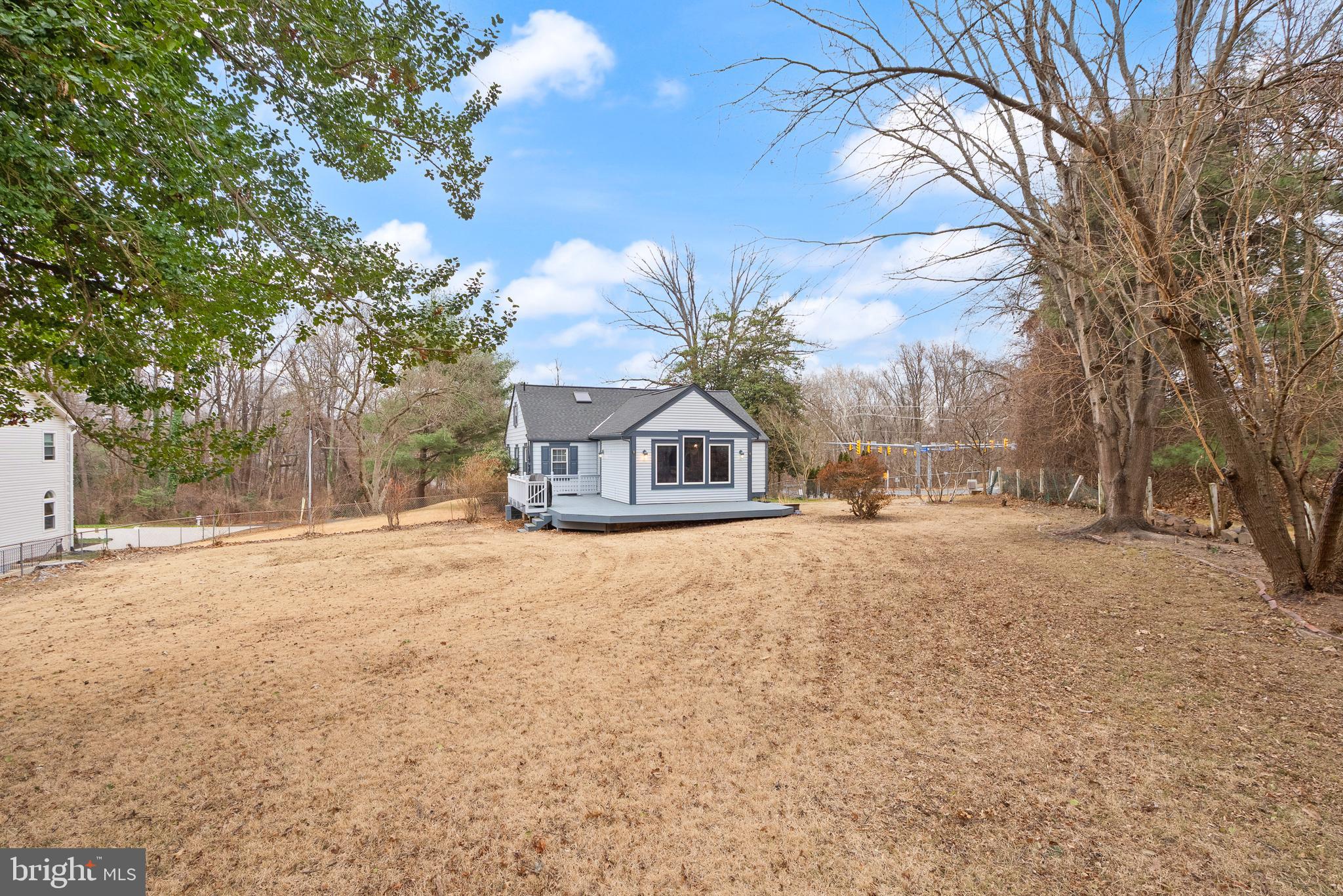 2928 Hunter Road Fairfax, VA 22031 - Photo 73 of 73 a yellow house with trees in front of it