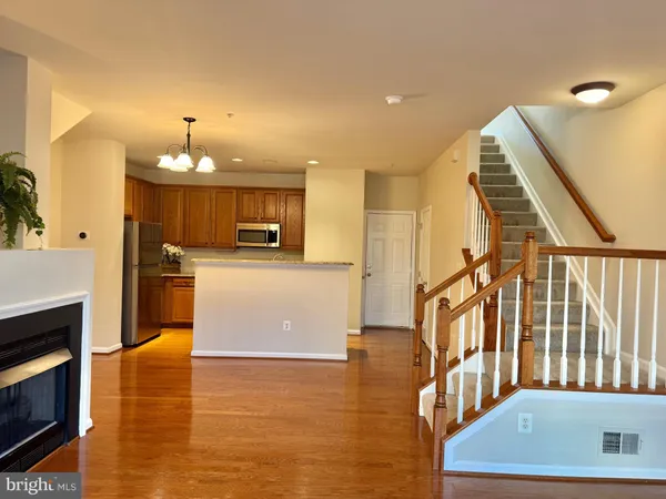 a view of a kitchen with furniture and a fireplace