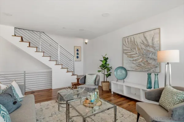 a living room with furniture and a lamp