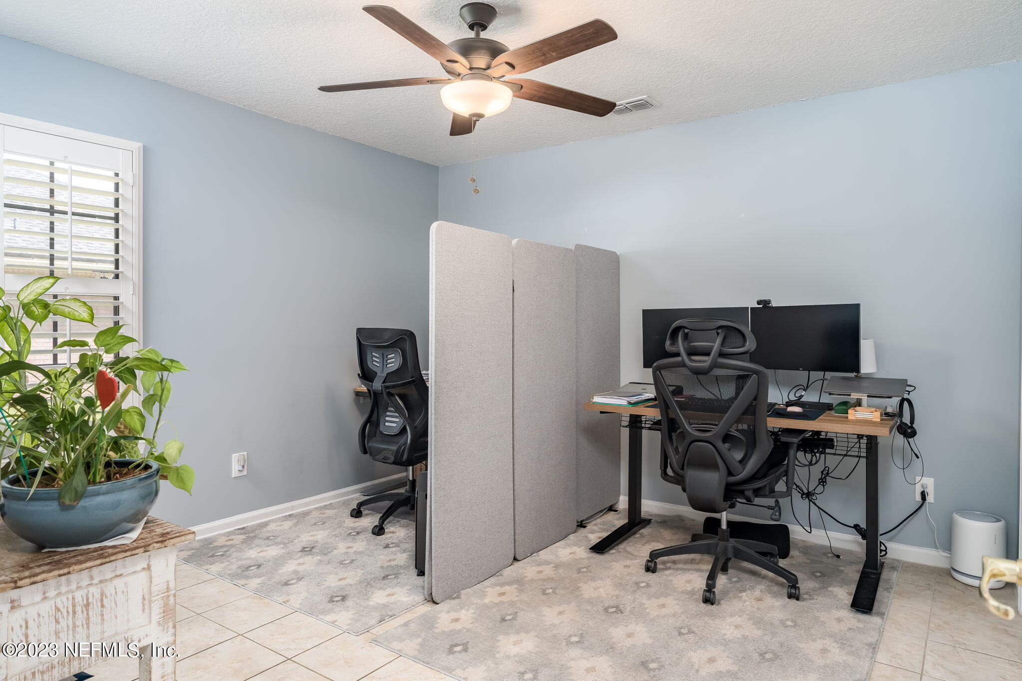 1662 Dockside Drive Fleming Island, FL 32003 - Photo 15 of 18 a view of a workspace with furniture and a window