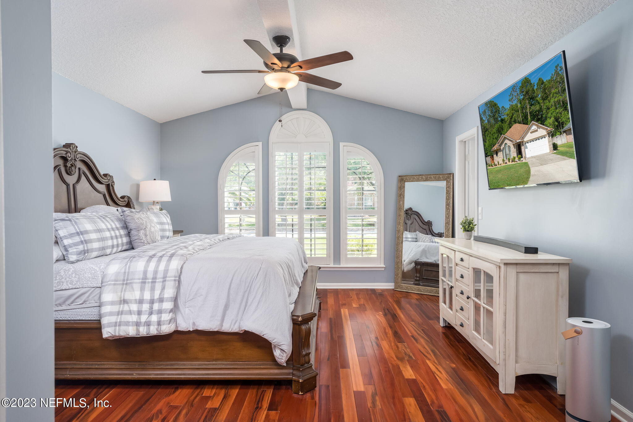 1662 Dockside Drive Fleming Island, FL 32003 - Photo 10 of 18 a bedroom with a bed and a chandelier