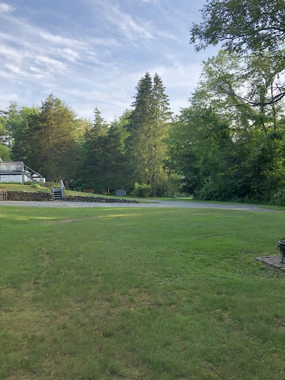 153 New Boston Road Sturbridge, MA 01566 - Photo 5 of 32 a view of a green field with clear sky