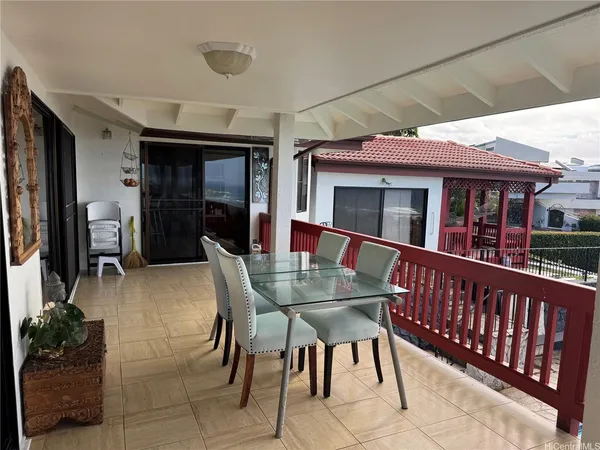 a kitchen with stainless steel appliances kitchen island granite countertop a table and chairs