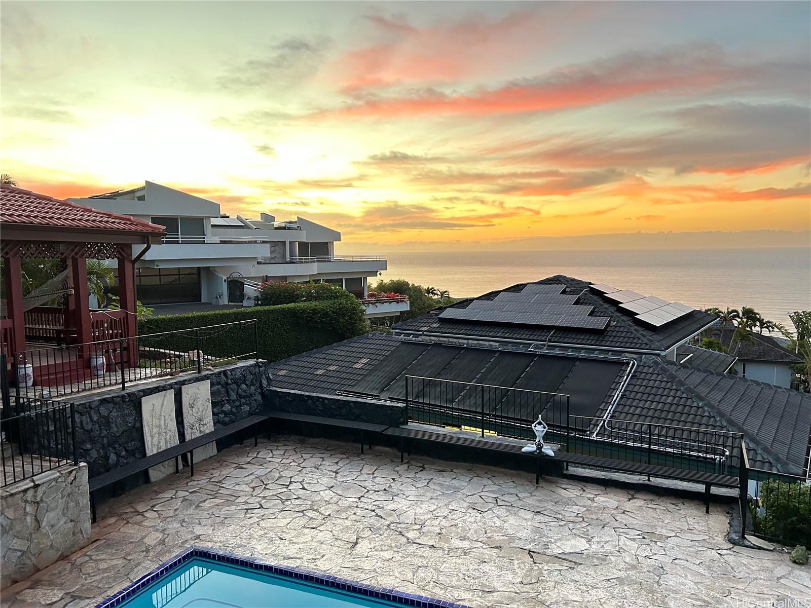 411 Maono Loop Honolulu, HI 96821 - Photo 4 of 13 a view of a house with a large window and wooden fence