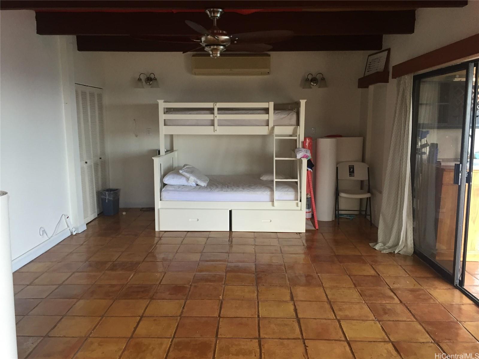 411 Maono Loop Honolulu, HI 96821 - Photo 7 of 13 a view of a hallway with a glass door