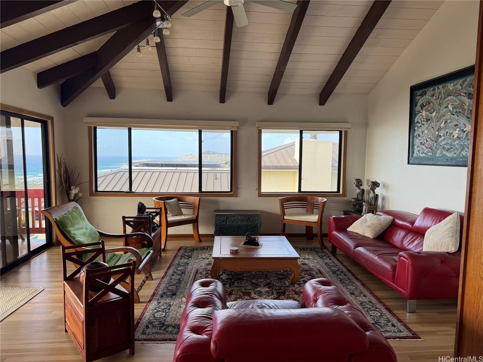 411 Maono Loop Honolulu, HI 96821 - Photo 10 of 13 a living room with furniture and a floor to ceiling window