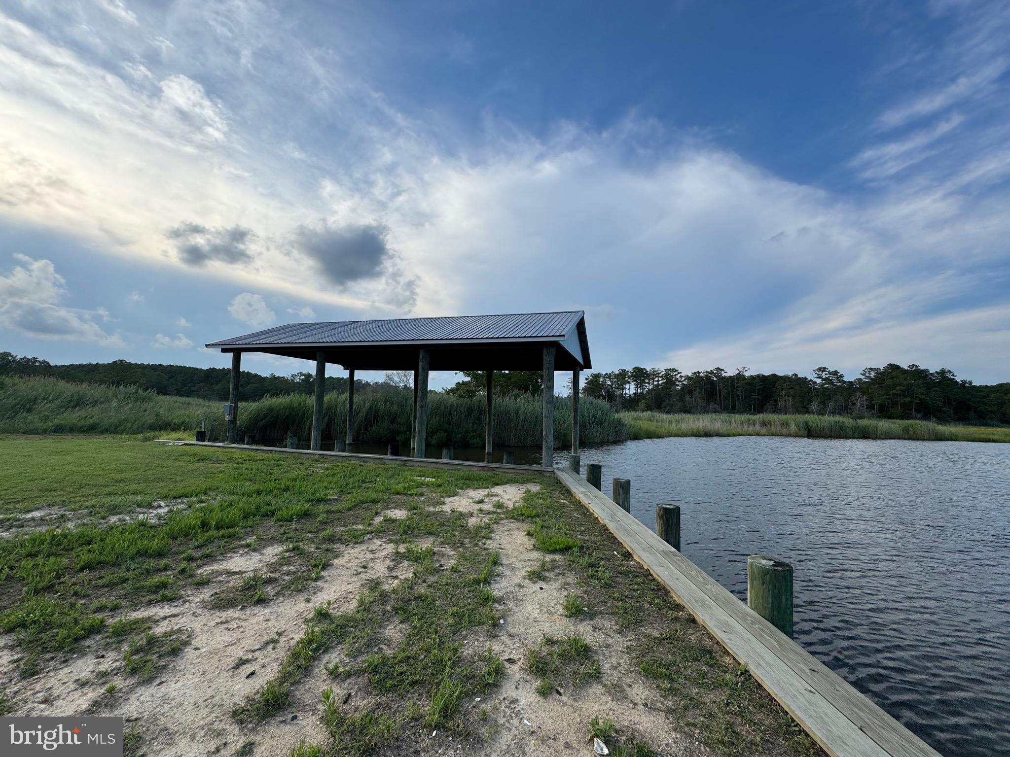 2707 Clara Road Tyaskin, MD 21865 - Photo 6 of 10 a view of a lake with a garden
