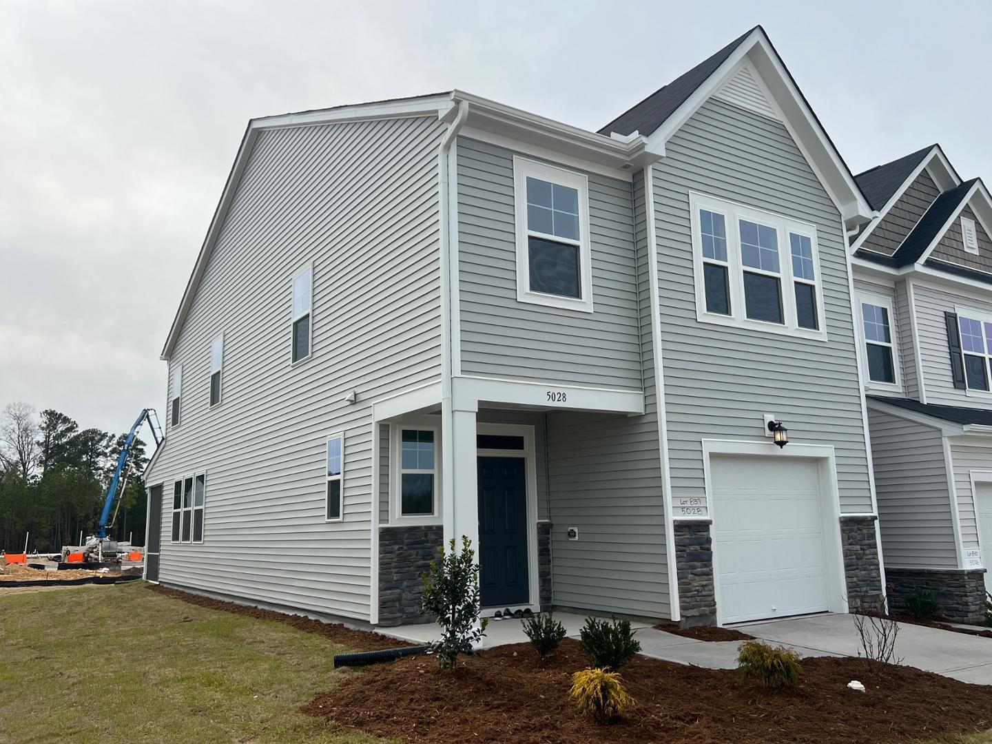 5028 Arkose Drive Raleigh, NC 27610 - Photo 1 of 36 a front view of a house with a yard