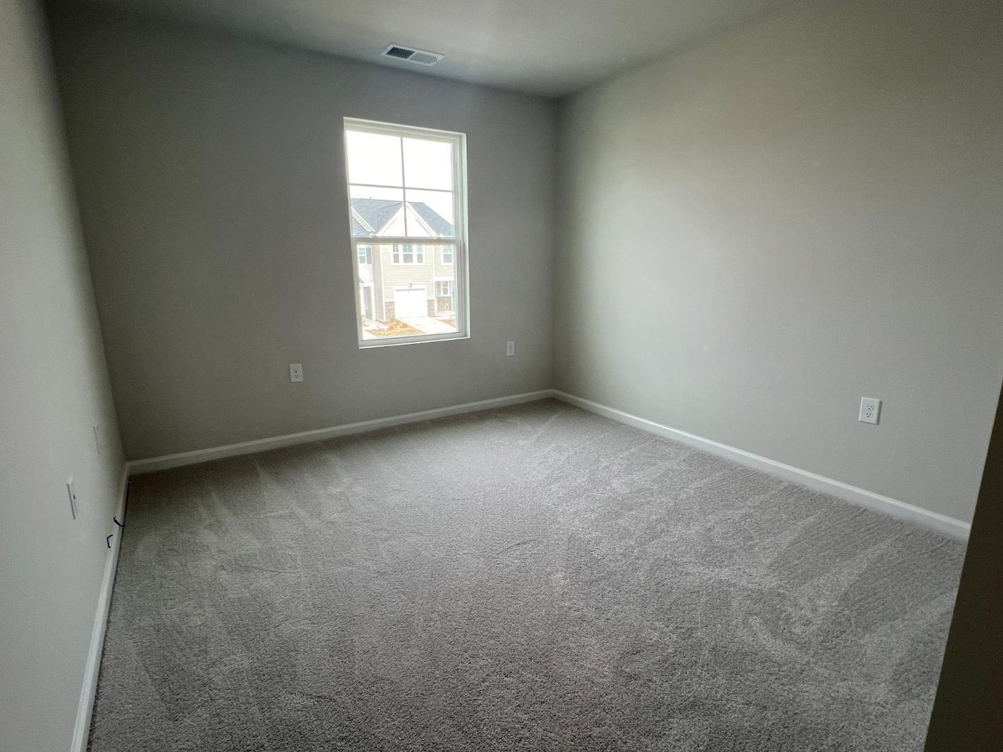 5028 Arkose Drive Raleigh, NC 27610 - Photo 11 of 36 an empty room with a window
