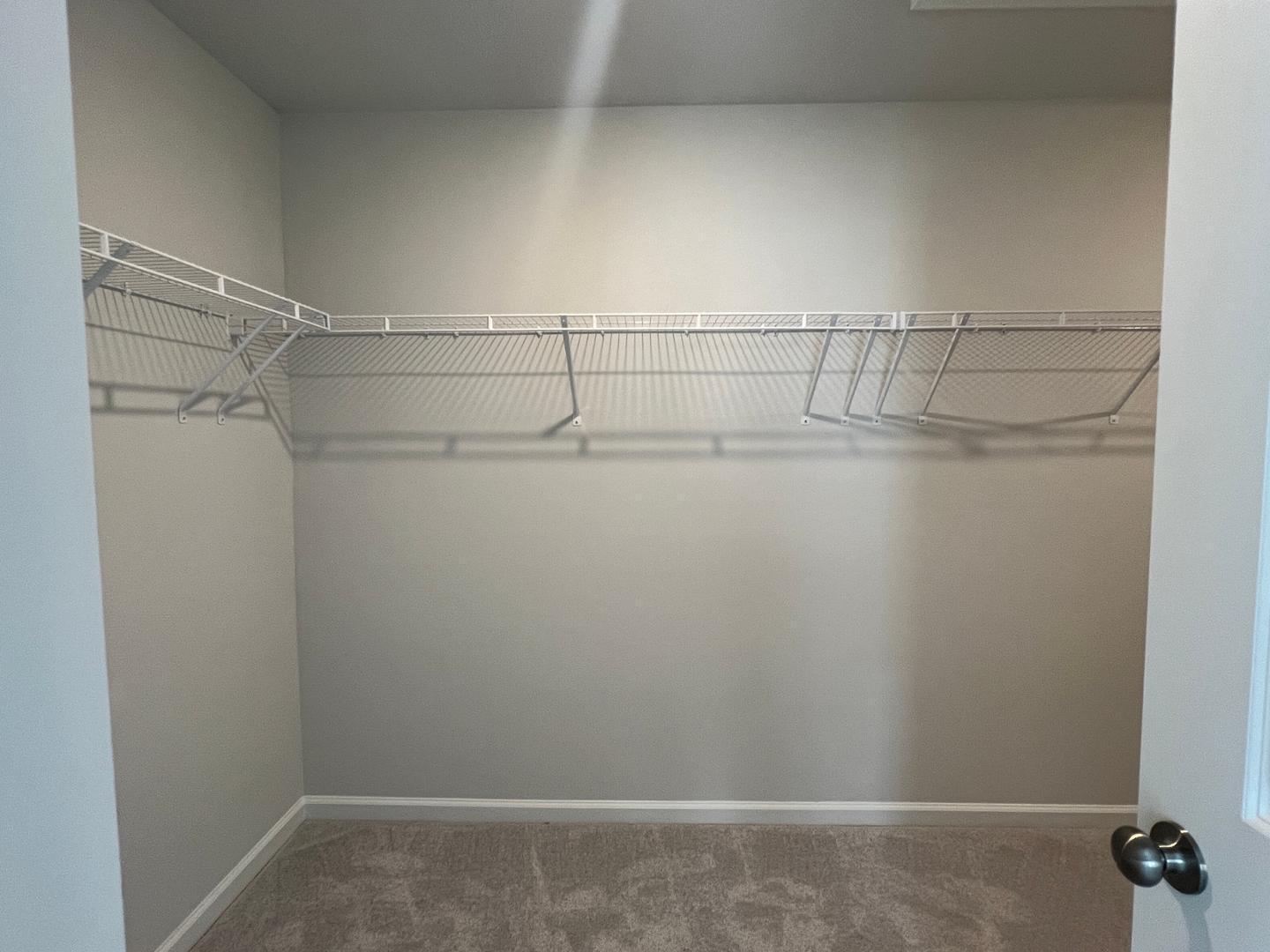 5028 Arkose Drive Raleigh, NC 27610 - Photo 12 of 36 a view of small space with racks on the wall