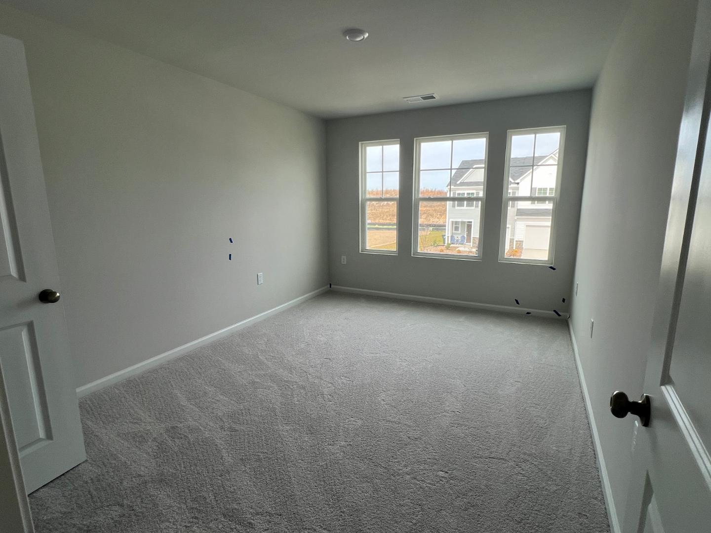 5028 Arkose Drive Raleigh, NC 27610 - Photo 17 of 36 a view of an empty room with a window