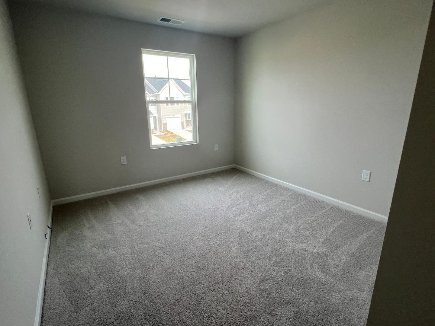5028 Arkose Drive Raleigh, NC 27610 - Photo 18 of 36 an empty room with a window