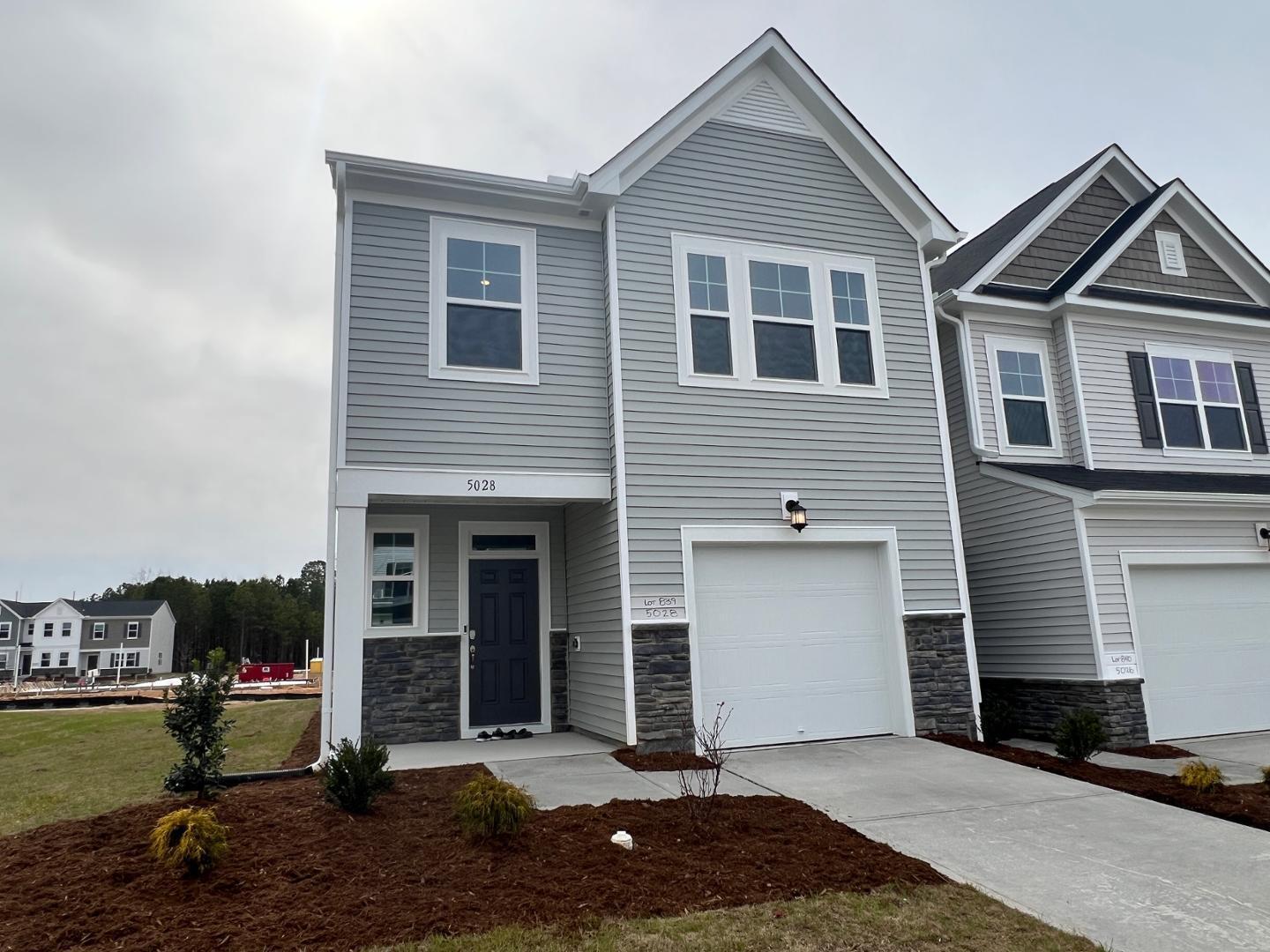 5028 Arkose Drive Raleigh, NC 27610 - Photo 2 of 36 a front view of a house with a yard