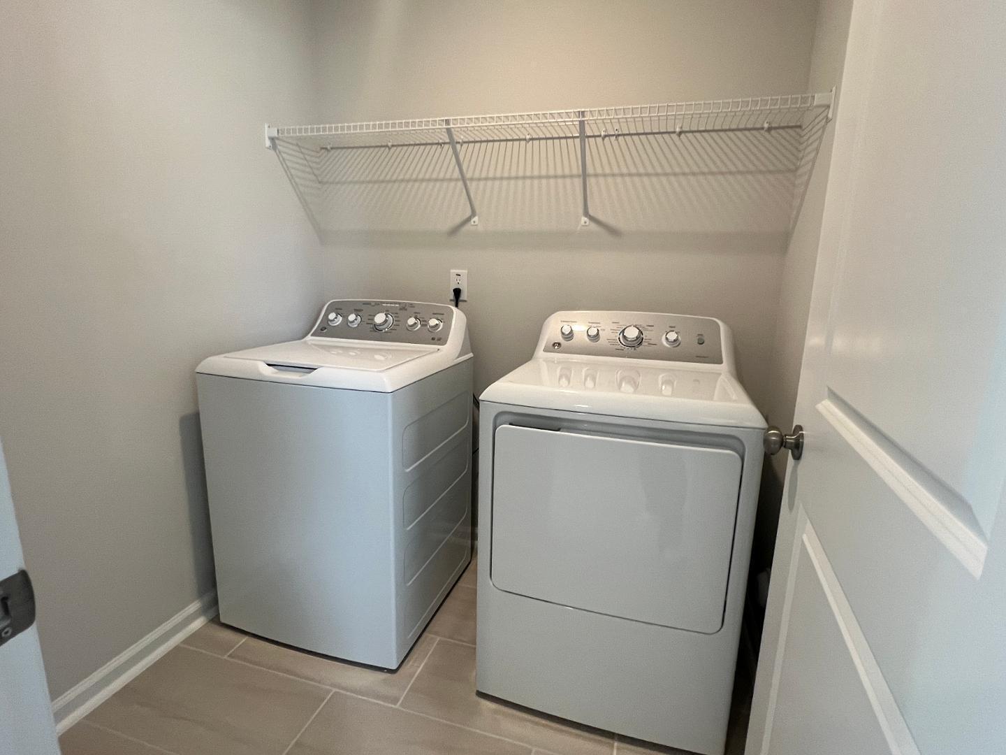 5028 Arkose Drive Raleigh, NC 27610 - Photo 21 of 36 a utility room with dryer and washer