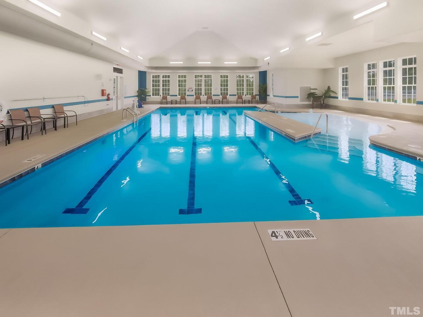 5028 Arkose Drive Raleigh, NC 27610 - Photo 31 of 36 a view of a kitchen with kitchen island and a view of living room