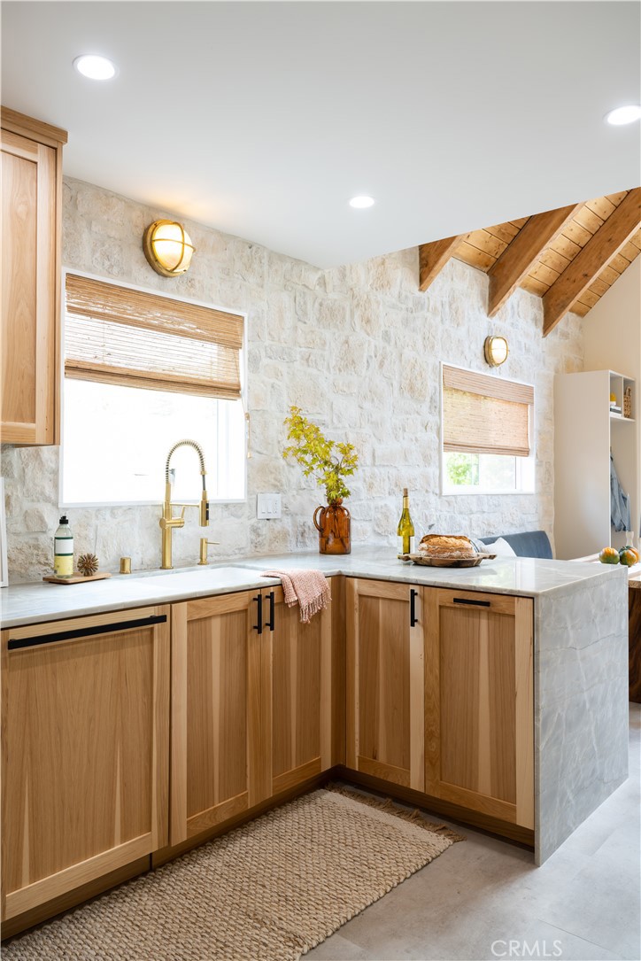 2358 Fir Drive Running Springs, CA 92382 - Photo 13 of 40 a kitchen with a sink and cabinets