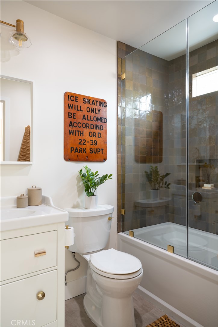 2358 Fir Drive Running Springs, CA 92382 - Photo 19 of 40 a bathroom with a sink a toilet and a bathtub