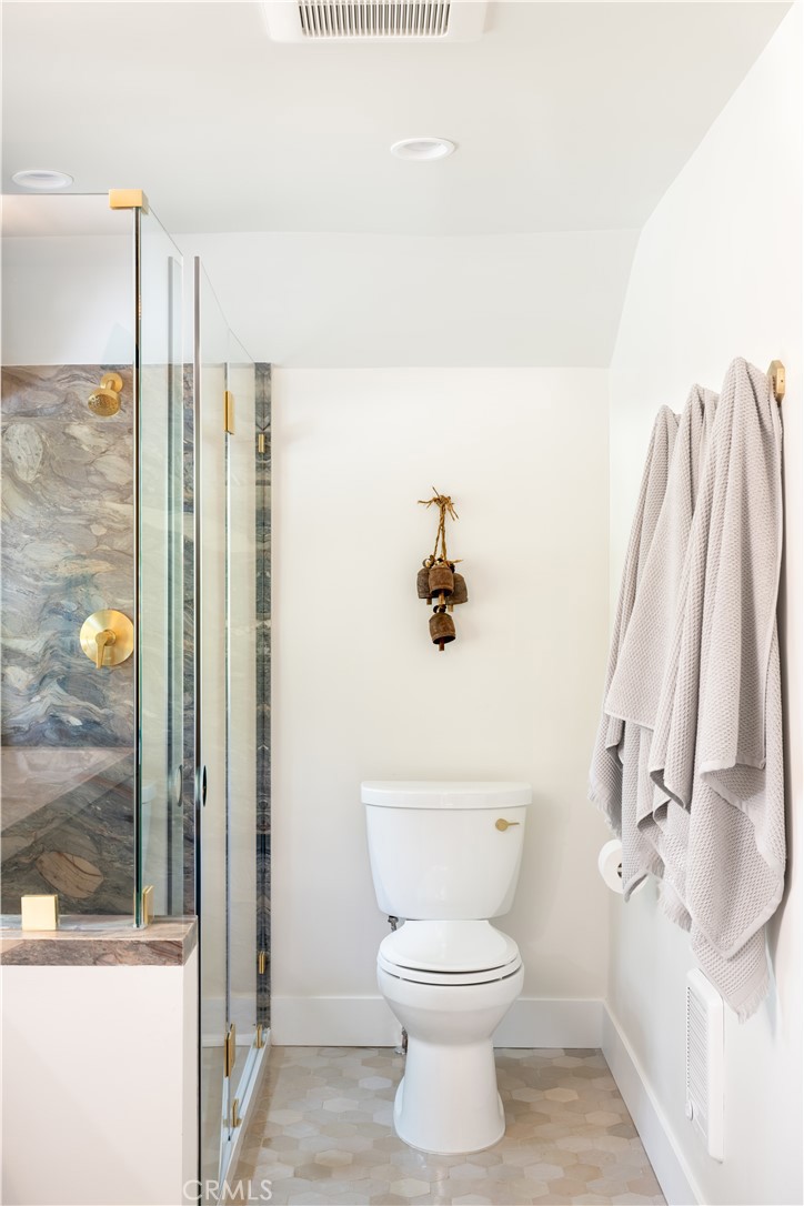 2358 Fir Drive Running Springs, CA 92382 - Photo 29 of 40 a bathroom with a toilet and a shower