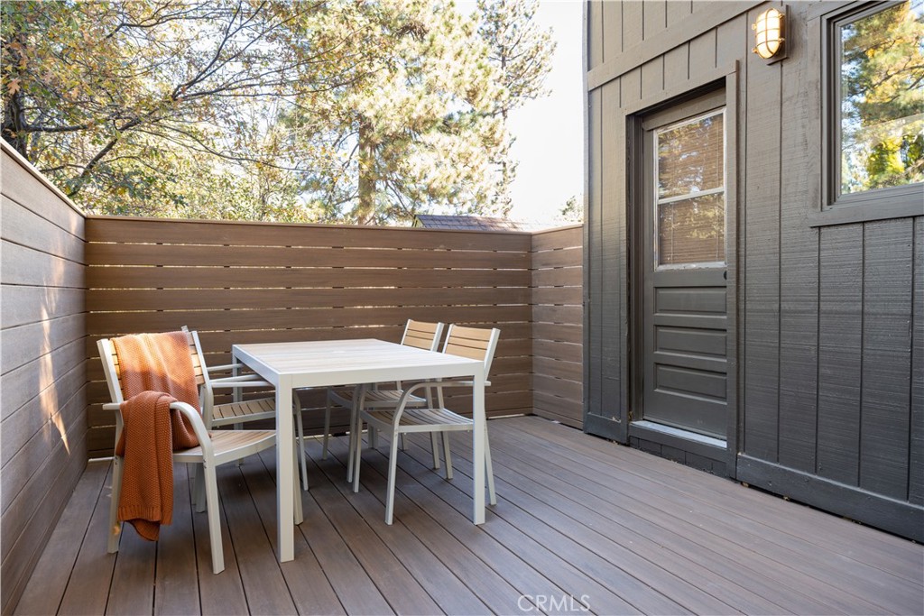 2358 Fir Drive Running Springs, CA 92382 - Photo 33 of 40 a table and chairs in front of a wooden door