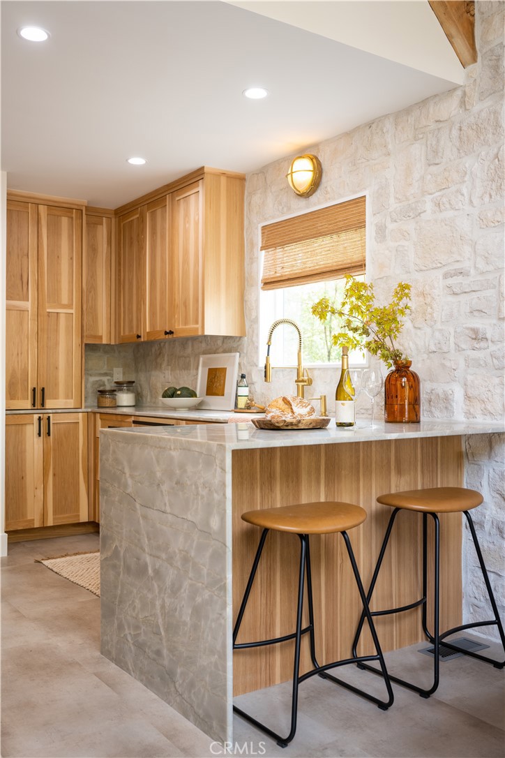 2358 Fir Drive Running Springs, CA 92382 - Photo 8 of 40 a kitchen with a sink cabinets and window