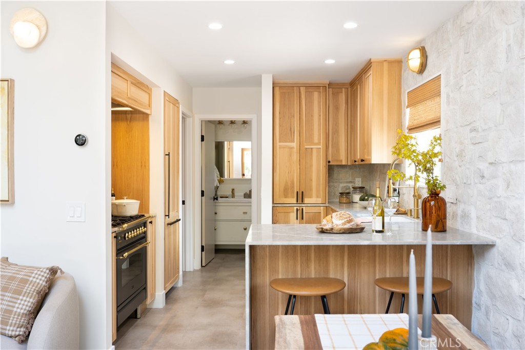 2358 Fir Drive Running Springs, CA 92382 - Photo 9 of 40 a kitchen with a refrigerator and a sink