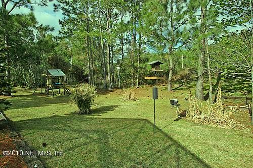 9949 Chelsea Lake Road Jacksonville, FL 32256 - Photo 8 of 19 Back Yard Behind Screened Lanai