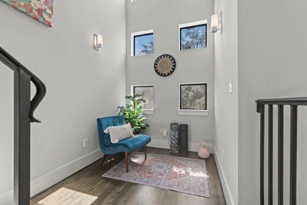 a view of a hallway with paintings on the wall